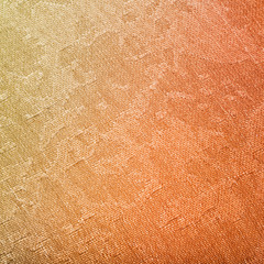 textile background - yellow and red painted fabric