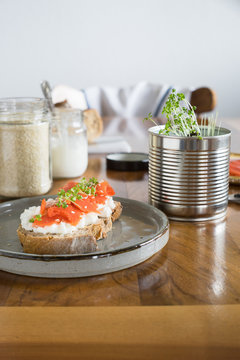 Salmon and cottage cheese sandwich served with garden cress. Selective focus.