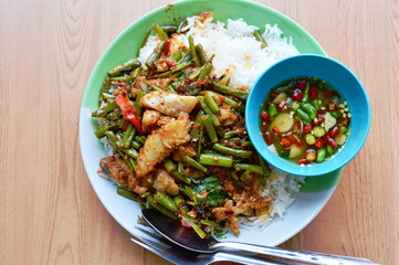 spicy stir-fried morning glory with dolly fish on rice