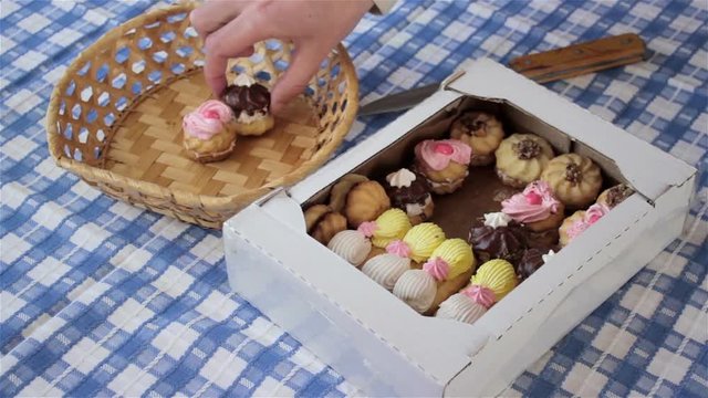 boxes of cookies/take the box of biscuits with cream and lay in a basket