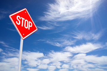 Roadside Red Stop Sign on a Cloudy Background