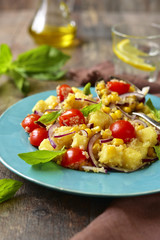 Vegetable salad with fried polenta and quinoa.