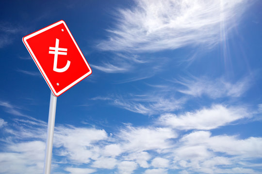 Red Road Sign with Turkih Lira Sign Inside on Blue Sky Backgroun