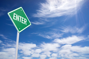Green Road Sign with Enter Sign Inside on Blue Sky Background
