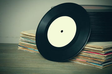 vinyl record collection on wooden background