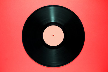 vinyl record close-up on red background