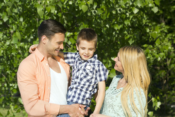 Fototapeta na wymiar Happy family outdoors on a sunny day