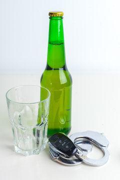 Drunk Driving Concept - Beer, Keys and Handcuffs