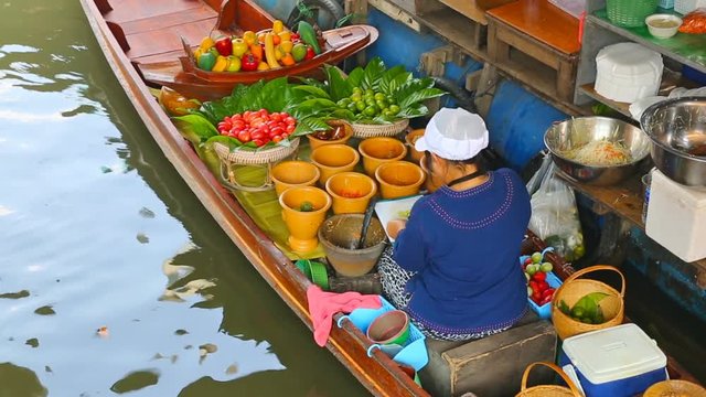 Cuisine on the boat - floating market in Bangkok, Thailand
