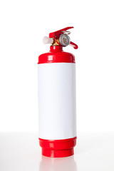 Red fire extinguisher isolated on white