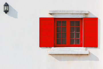 Colorful red window and Detail of house exterior.
