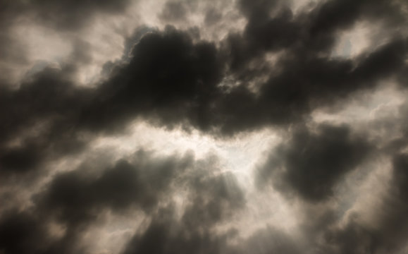 dark gray dramatic sky with large clouds.
