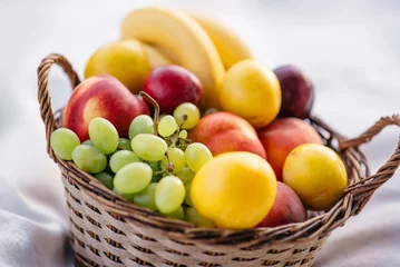 Zelfklevend Fotobehang fruit basket on a white background © MZaitsev