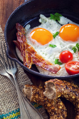 Tasty breakfast with fried eggs and baco