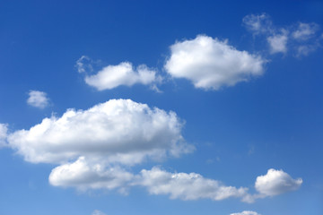 Naklejka na ściany i meble view on clouds in blue sky