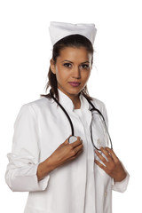 a young beautiful nurse posing with stethoscope