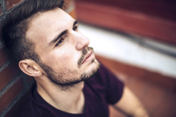 Fototapeta premium Handsome caucasian young man in casual clothes in urban environm