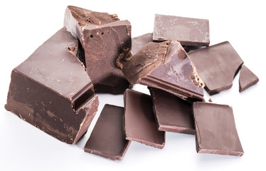 Chocolate blocks and pieces of chocolate bar isolated on a white