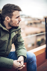 Obraz premium Handsome caucasian young man in casual clothes in urban environm