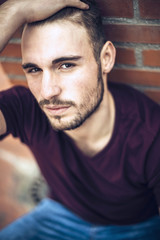 Fototapeta premium Handsome caucasian young man in casual clothes in urban environm