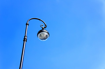 street lamppost against the blue sky