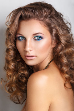 Blue beauty fashion make-up.Beautiful young model with bright make-up and manicure