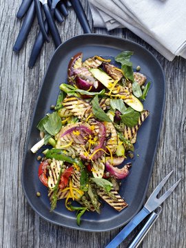 Overhead view of vegetable salad on barbecue griddle pan