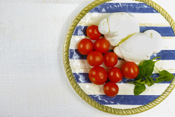 Traditional italian mozzarella buffala with tomatoes and basil o
