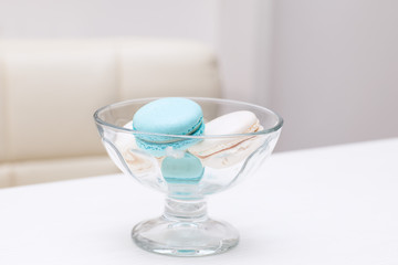 macaroons lies in a glass vase for sweets