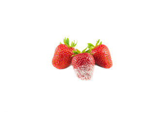 Three strawberries in sugar