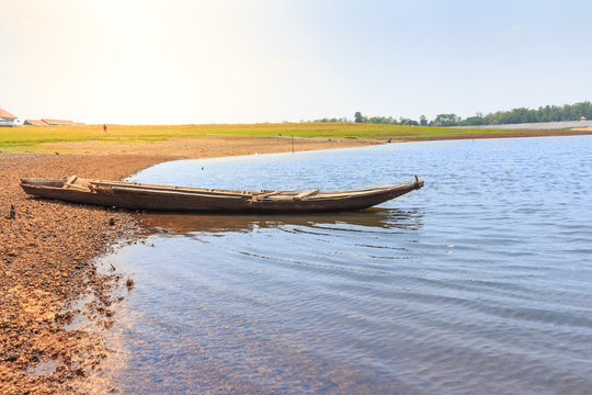 beautiful landscape with wooden boat on the river