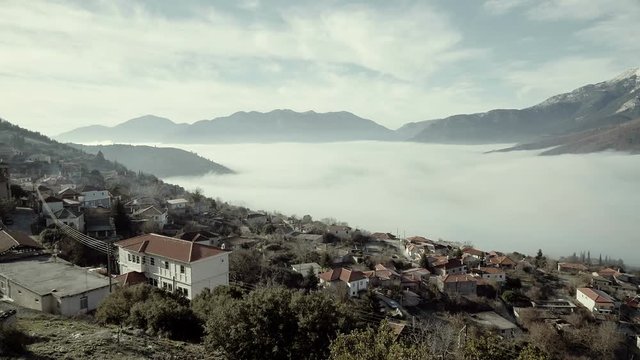Greek countryside landscape overview mountains,skyline.A locked down winter wide angle view shot of the graphic village of Goura in Corinthia of Pelopponisos,Greece.