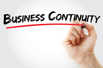 Hand writing Business Continuity with marker, concept background