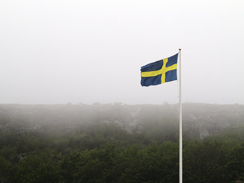 Swedish flag at foggy day