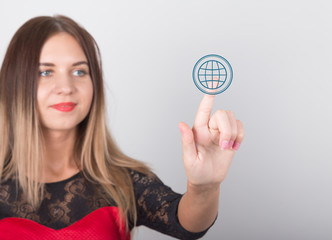 technology, internet and networking concept. beautiful woman in a red dress with lace sleeves. woman presses online button on virtual screens