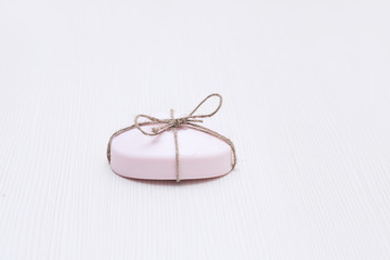 a piece of pink soap on the table