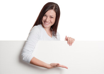 Naklejka premium Girl showing on sheet of paper