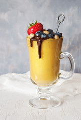 Mango smoothie and berries