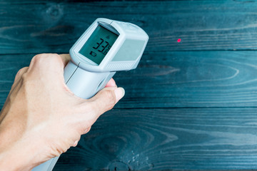 Hand hold the IR thermometer