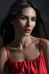 Closeup portrait of woman in red dress