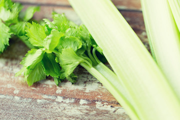 close up of celery stems on wooden table