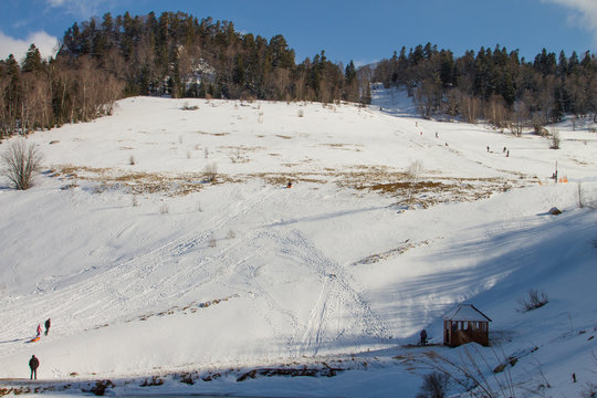 snow hill at sunny winter day
