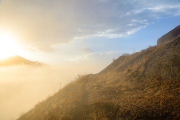 Morning sunburst over Alamat Castle, Iran