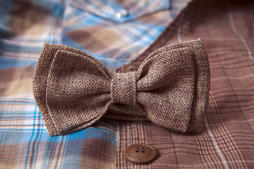 Men's accessories - bow tie on textile background