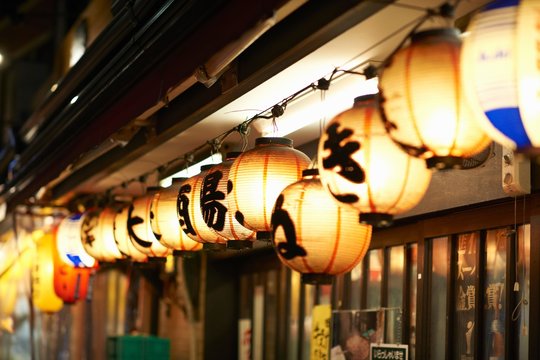 Row of illuminated paper lanterns at night, Tokyo, Japan