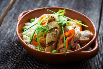 Delicious baked chicken breast and rice with chili and salad