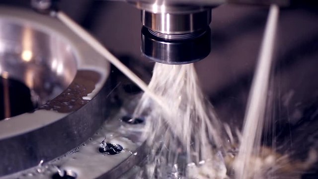 CNC milling machine makes steel part on a industrial factory HD.