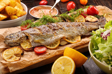 Baked fish with roasted potatoes and salad