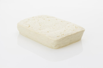 Tofu block, isolated on white background.
