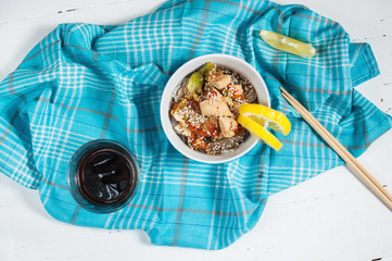 Cooked funchoza with chicken fillet and toasted sesame seeds